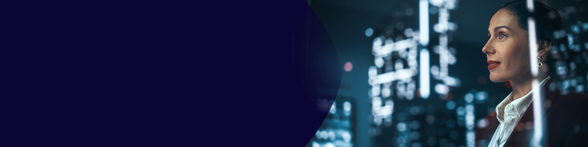 Colleagues discussing insights on a tablet while seated on colorful lounge chairs in an open workspace.