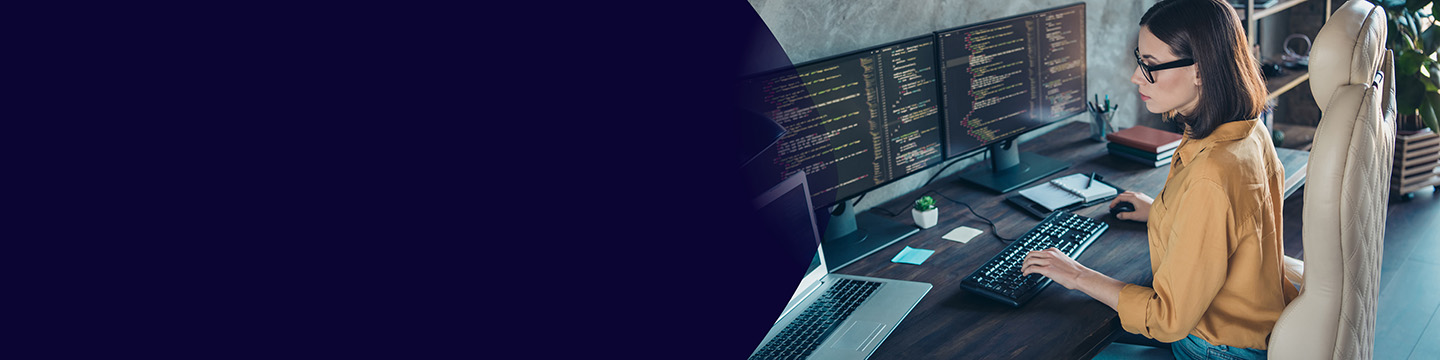 Colleagues discussing insights on a tablet while seated on colorful lounge chairs in an open workspace.